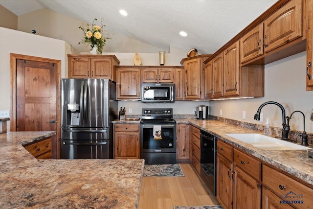 kitchen with stainless steel fridge with ice dispenser, electric range, a sink, lofted ceiling, and black dishwasher