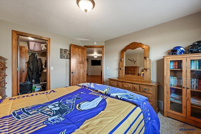 bedroom featuring a closet and carpet