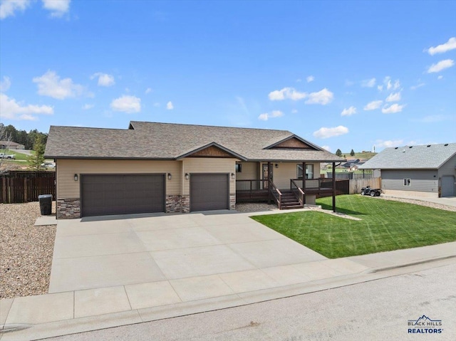 view of front of property featuring a garage, a porch, driveway, stone siding, and roof with shingles