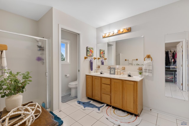 4037 Valley W Dr, Rapid City, SD 57702 - full bathroom with a shower stall, double vanity, toilet, tile patterned floors, and baseboards