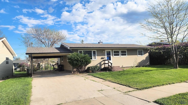 2408 Judy Ave, Rapid City, SD 57702 - view of front of house with concrete driveway, a front lawn, and an attached carport