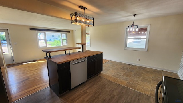 2408 Judy Ave, Rapid City, SD 57702 - kitchen with wood counters, dishwasher, dark cabinets, and healthy amount of natural light