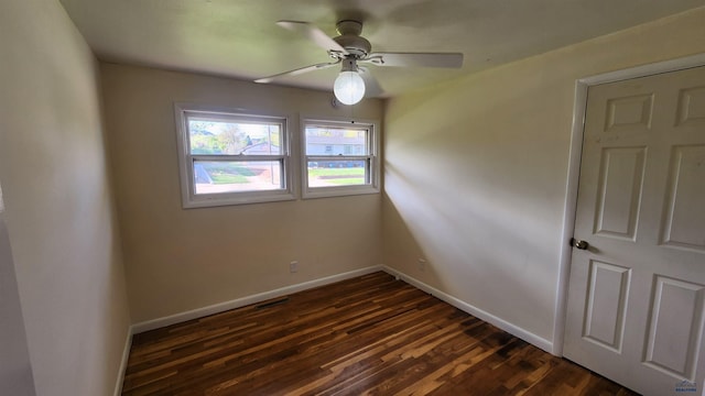 2408 Judy Ave, Rapid City, SD 57702 - unfurnished room with ceiling fan, baseboards, and dark wood finished floors