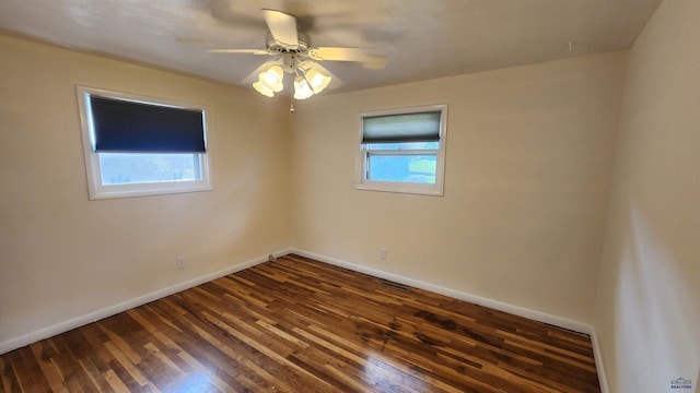 2408 Judy Ave, Rapid City, SD 57702 - spare room with dark wood-style floors, baseboards, and ceiling fan