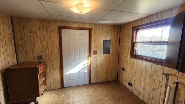 2408 Judy Ave, Rapid City, SD 57702 - entryway featuring wooden walls, electric panel, and a drop ceiling
