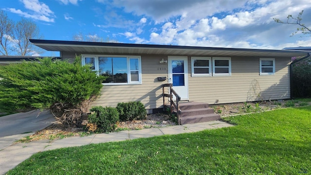 2408 Judy Ave, Rapid City, SD 57702 - bungalow-style home featuring a front lawn