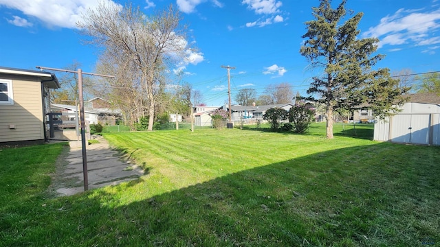 2408 Judy Ave, Rapid City, SD 57702 - view of yard featuring a shed, an outbuilding, and a residential view