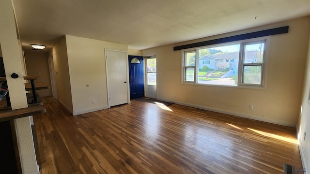 2408 Judy Ave, Rapid City, SD 57702 - empty room featuring dark wood-type flooring and baseboards