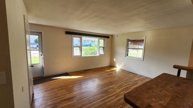 2408 Judy Ave, Rapid City, SD 57702 - spare room featuring wood finished floors, baseboards, and a textured ceiling