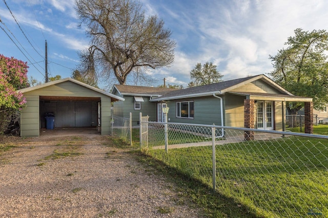 3432 Jackson Blvd, Rapid City, SD 57702 - ranch-style house featuring dirt driveway, french doors, a carport, and an outbuilding