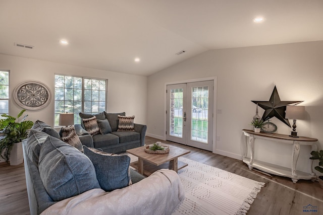 3432 Jackson Blvd, Rapid City, SD 57702 - living room featuring vaulted ceiling, wood finished floors, healthy amount of natural light, french doors, and baseboards