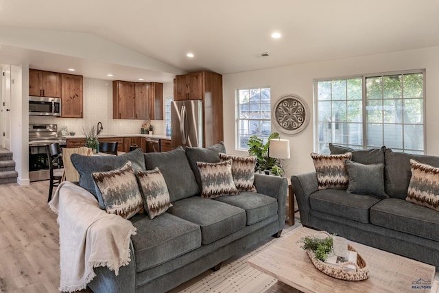 3432 Jackson Blvd, Rapid City, SD 57702 - living room with vaulted ceiling, light wood-style floors, and recessed lighting