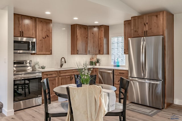 3432 Jackson Blvd, Rapid City, SD 57702 - kitchen with stainless steel appliances, a sink, tasteful backsplash, light countertops, and recessed lighting