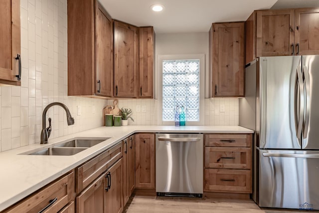 3432 Jackson Blvd, Rapid City, SD 57702 - kitchen featuring stainless steel appliances, a sink, light wood-style flooring, backsplash, and recessed lighting