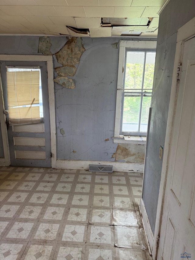 spare room with light flooring