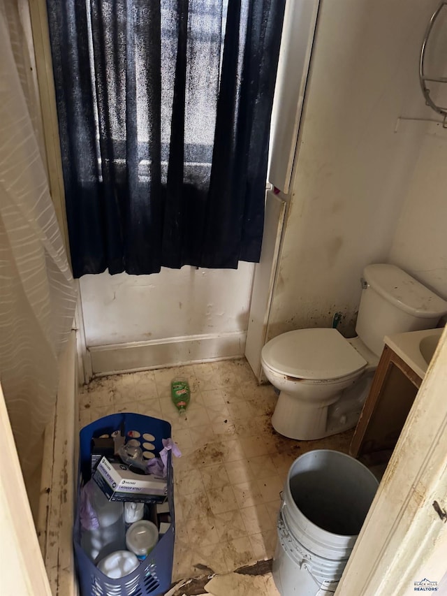 bathroom with tile patterned floors and toilet