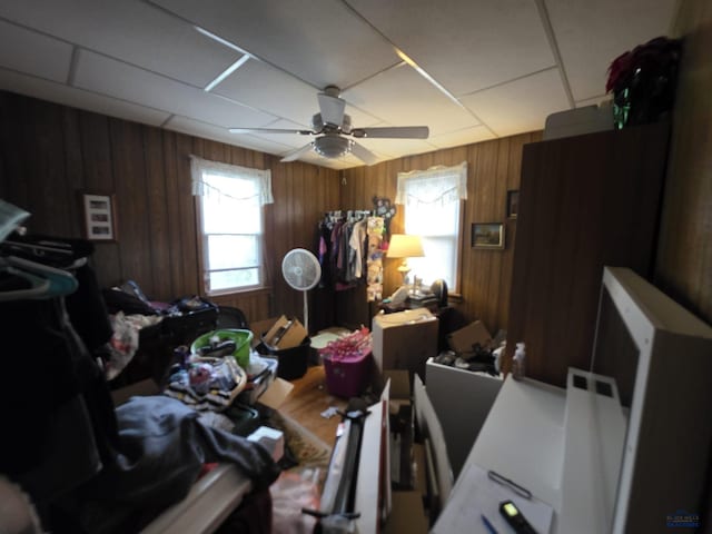 142 W Summit, Lead, SD 57754 - bedroom featuring wood walls, a paneled ceiling, and a ceiling fan