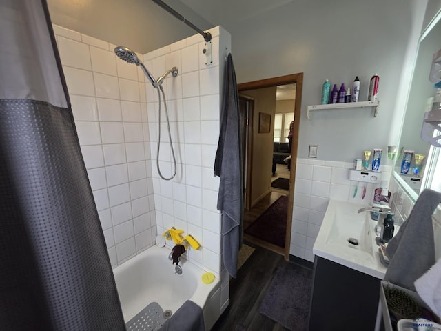 142 W Summit, Lead, SD 57754 - bathroom with tile walls, shower / tub combo, wood finished floors, a wainscoted wall, and vanity