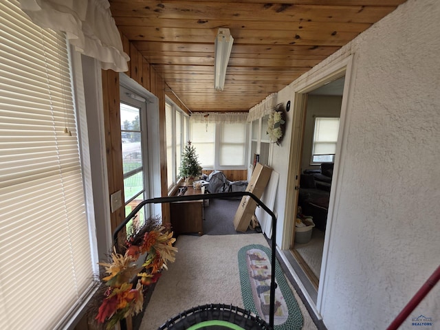 142 W Summit, Lead, SD 57754 - sunroom / solarium featuring carpet, a textured wall, and wood ceiling