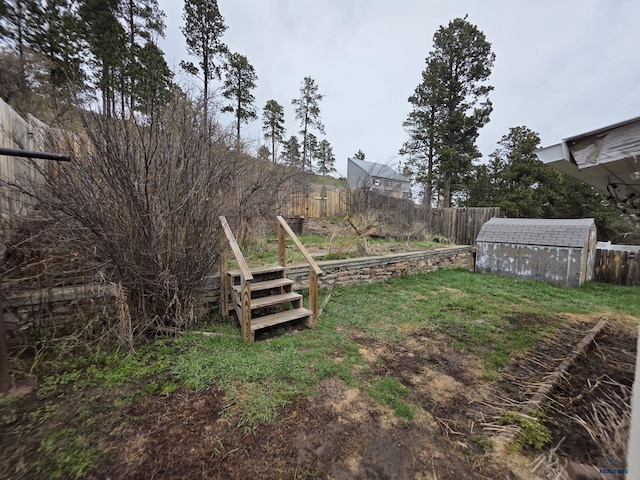 142 W Summit, Lead, SD 57754 - fenced backyard featuring a shed and an outdoor structure