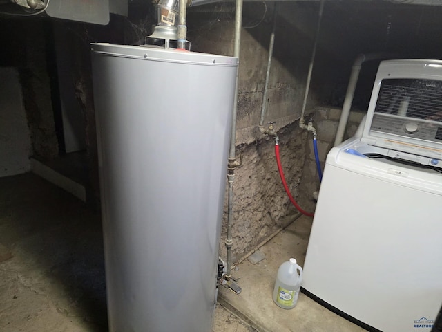 142 W Summit, Lead, SD 57754 - utility room featuring water heater and washer / clothes dryer