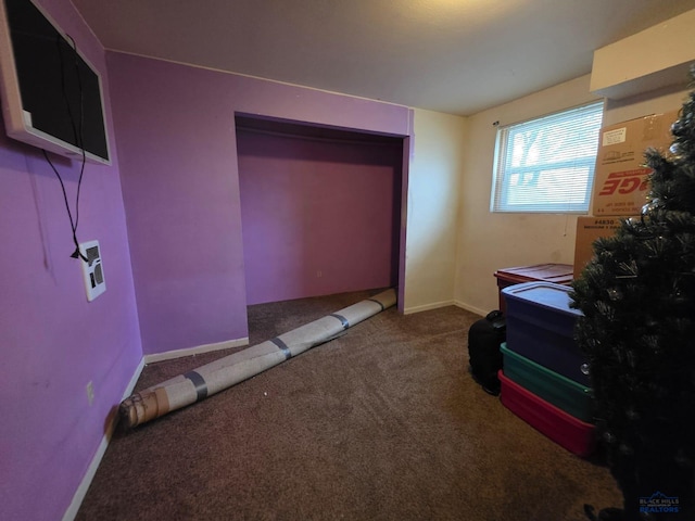 bedroom featuring carpet floors and baseboards