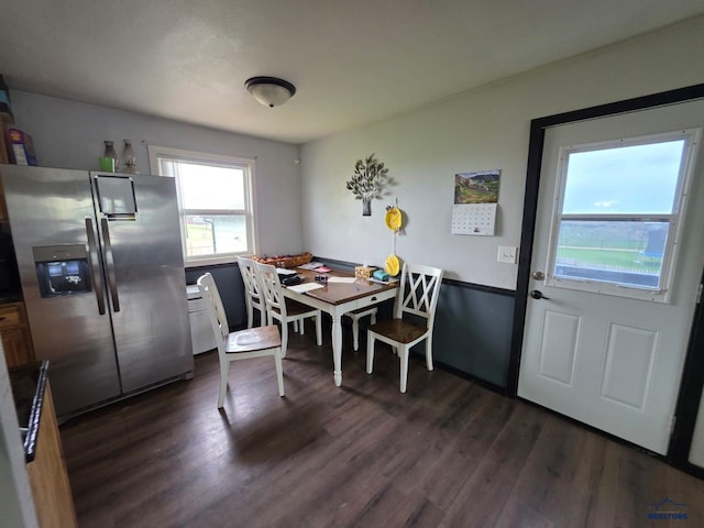 dining area featuring dark wood-style floors