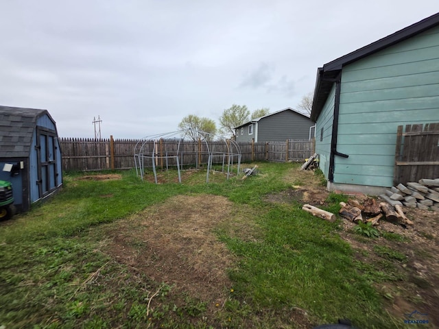 view of yard with a shed and an outdoor structure