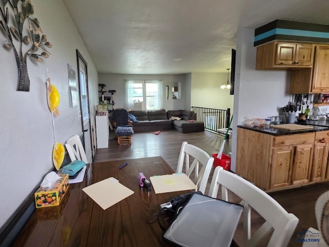 dining area with dark wood-type flooring