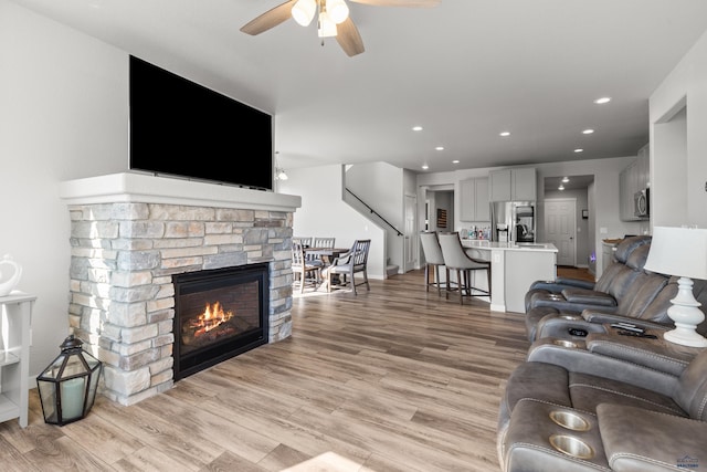 506 Solomon Ct, Rapid City, SD 57703 - living area with a ceiling fan, a fireplace, light wood-style flooring, and recessed lighting