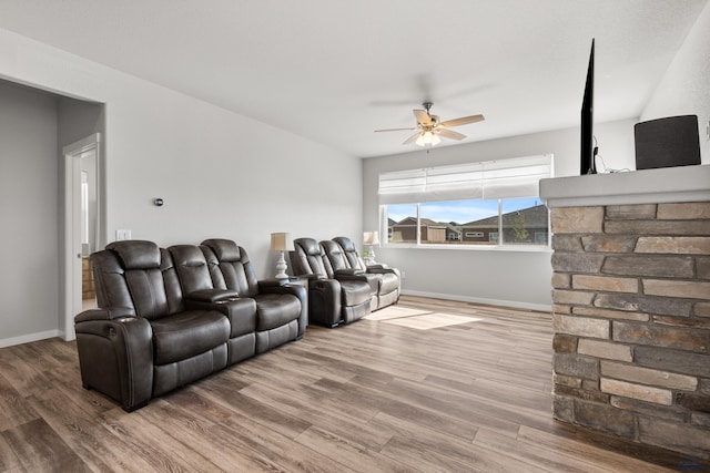 506 Solomon Ct, Rapid City, SD 57703 - home theater with ceiling fan, wood finished floors, and baseboards