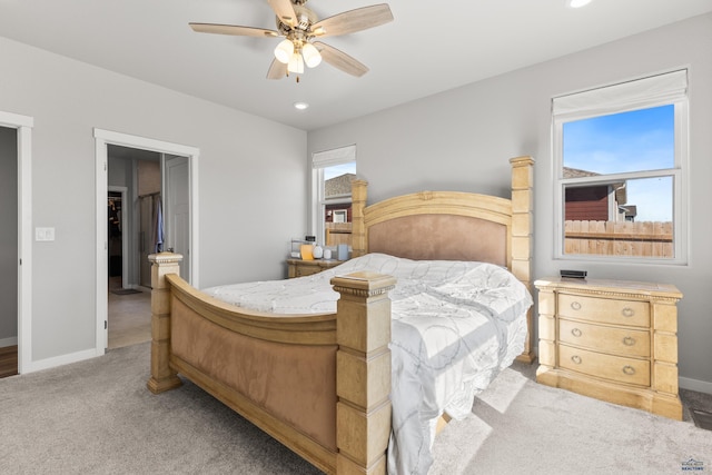 506 Solomon Ct, Rapid City, SD 57703 - bedroom featuring light colored carpet, baseboards, recessed lighting, ceiling fan, and connected bathroom