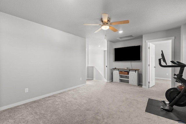 506 Solomon Ct, Rapid City, SD 57703 - workout room with light colored carpet, baseboards, and ceiling fan