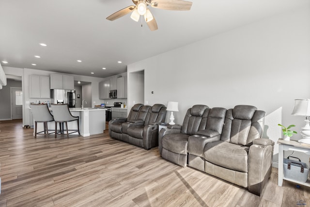506 Solomon Ct, Rapid City, SD 57703 - living room featuring a ceiling fan, light wood-style flooring, and recessed lighting