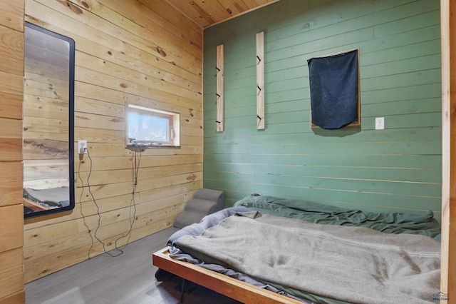 24427 Thovson Rd, Keystone, SD 57751 - bedroom featuring wood walls, wood finished floors, and wooden ceiling