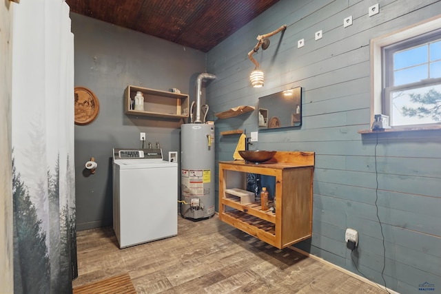 24427 Thovson Rd, Keystone, SD 57751 - laundry area featuring washer / dryer, water heater, wood finished floors, wood ceiling, and wooden walls