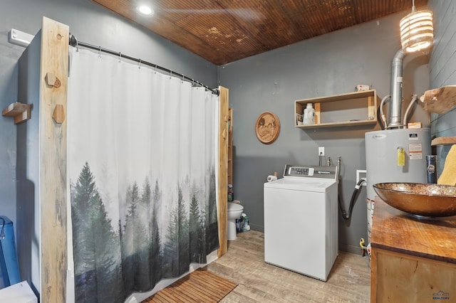 24427 Thovson Rd, Keystone, SD 57751 - laundry room with washer / dryer, light wood finished floors, water heater, wood ceiling, and recessed lighting