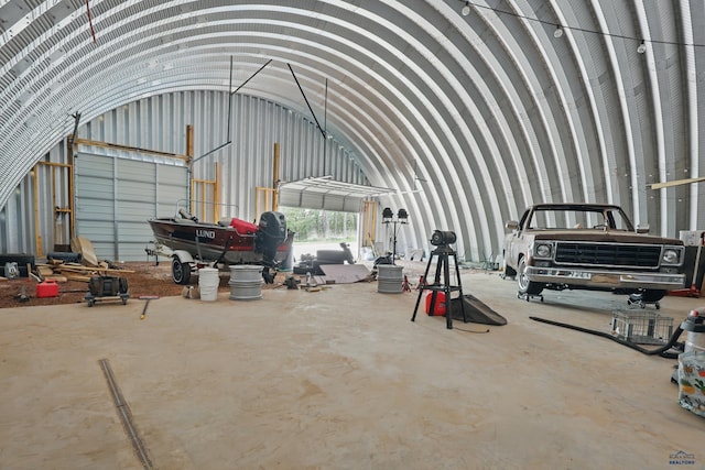 24427 Thovson Rd, Keystone, SD 57751 - miscellaneous room featuring a garage, concrete floors, and lofted ceiling