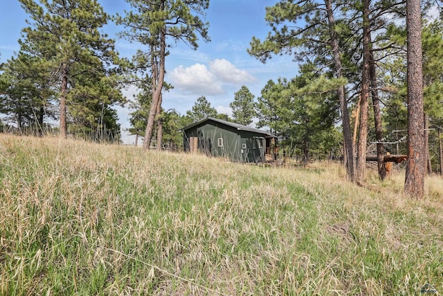 24427 Thovson Rd, Keystone, SD 57751 - view of yard with an outdoor structure and an outbuilding