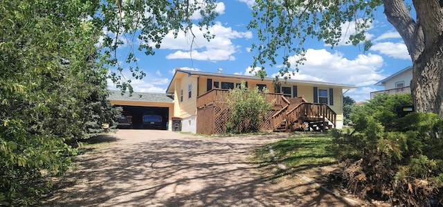 4218 Sweetbriar, Rapid City, SD 57703 - ranch-style house featuring dirt driveway, stairs, and a deck