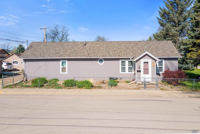 819 Sly St, Sturgis, SD 57785 - ranch-style house featuring stucco siding, fence, and a shingled roof