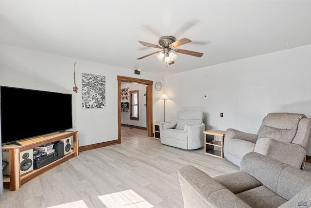 819 Sly St, Sturgis, SD 57785 - living area with a ceiling fan, light wood-type flooring, and baseboards