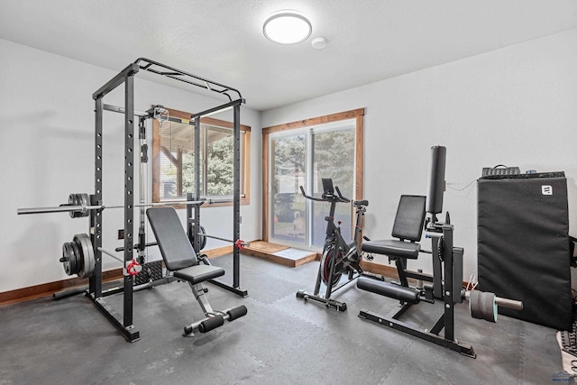819 Sly St, Sturgis, SD 57785 - exercise area featuring baseboards and a textured ceiling