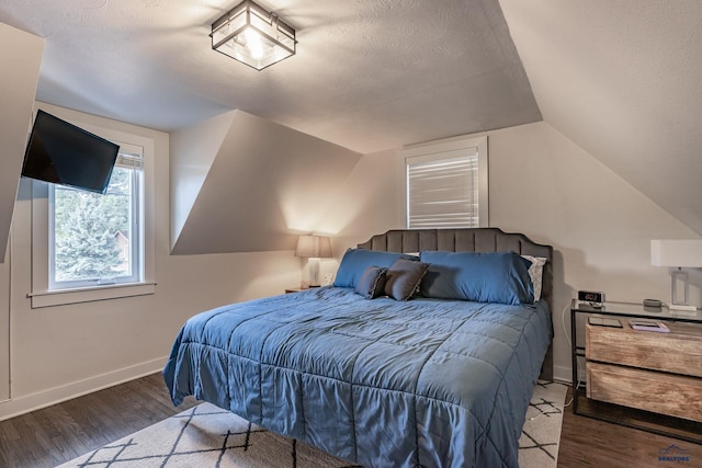 1316 Clark, Rapid City, SD 57701 - bedroom featuring wood finished floors, lofted ceiling, baseboards, and a textured ceiling