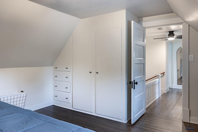1316 Clark, Rapid City, SD 57701 - unfurnished bedroom featuring dark wood-style flooring, vaulted ceiling, and baseboards