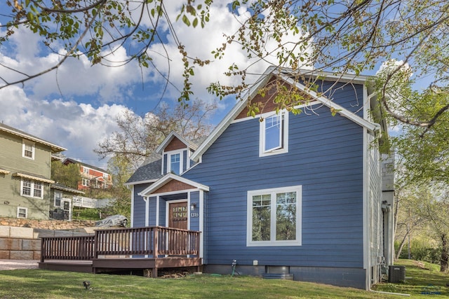 1316 Clark, Rapid City, SD 57701 - rear view of house featuring a wooden deck, central AC unit, and a yard