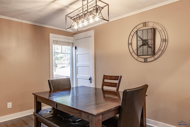 1316 Clark, Rapid City, SD 57701 - dining area with a chandelier, baseboards, dark wood-style flooring, and ornamental molding