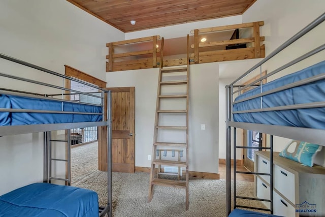 21172 Last Chance Trl, Lead, SD 57754 - carpeted bedroom featuring wooden ceiling and baseboards