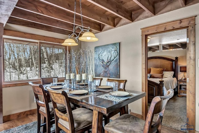21172 Last Chance Trl, Lead, SD 57754 - dining space with wooden ceiling, beam ceiling, wood finished floors, and baseboards