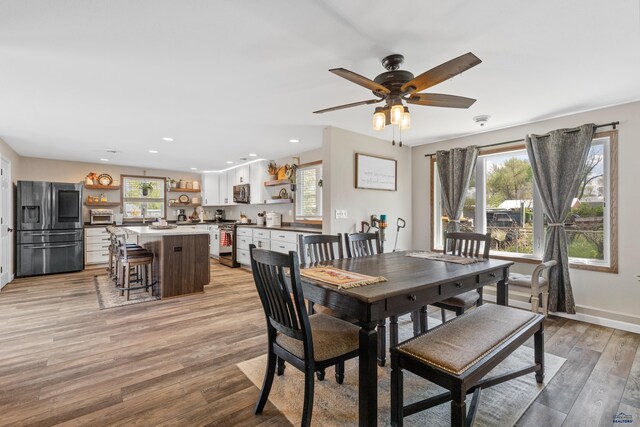 202 S B Ave, New Underwood, SD 57761 - dining area featuring light wood finished floors, a ceiling fan, baseboards, and recessed lighting
